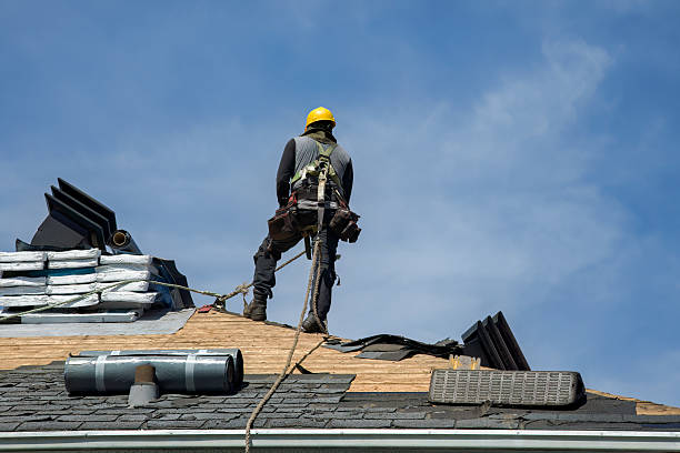 Professional Storm Damage Roof Repair technician working in Liberty Center, IA
